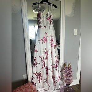 Brand new White gown with big fuchsia roses, big slit and pockets. Size 5/6.